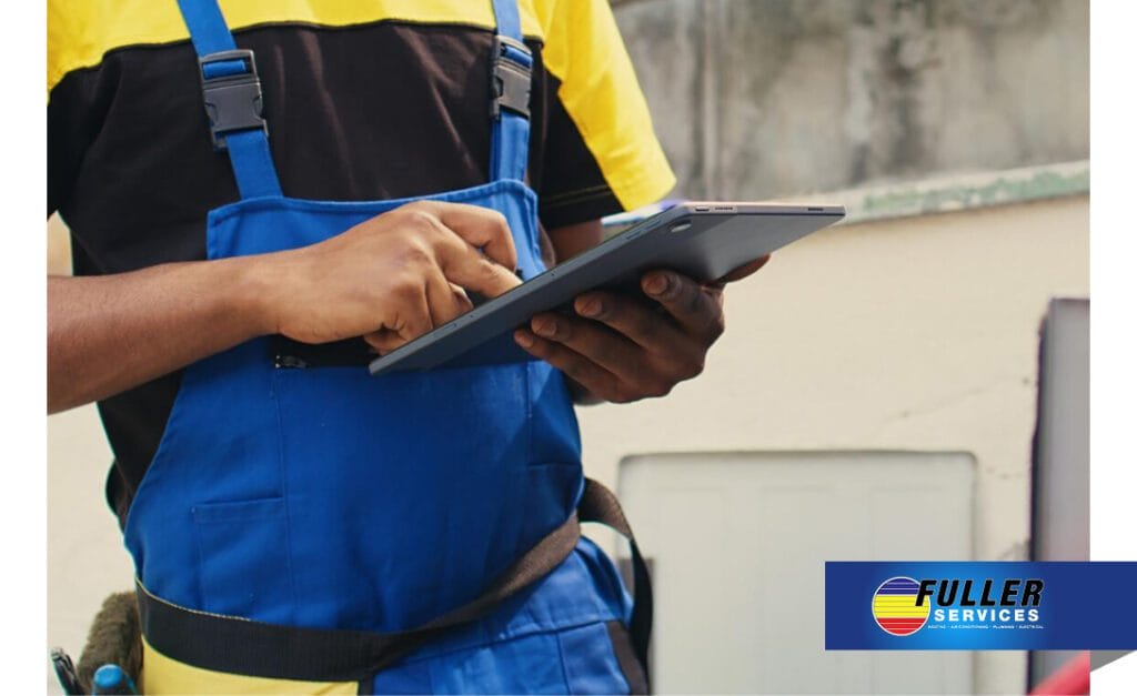 HVAC technician using a tablet for outdoor installation planning and inspection