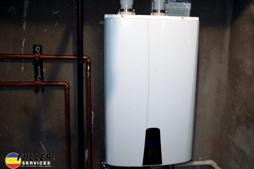 Wall-mounted tankless water heater installed with copper piping and venting.