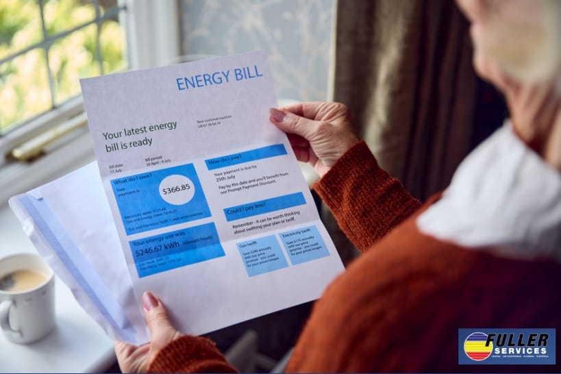 Homeowner reviewing an energy bill while considering thermostat settings that may affect heating and cooling costs.